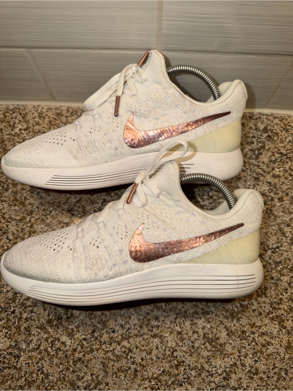 Nike Women’s Cream/White Flyknit Running Shoes with Rose Gold Swoosh